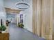Long hallway with modern lighting, wooden accent wall and neutral paint at 1525 Shinnville Rd, Cleveland, NC 27013