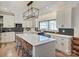 Gourmet kitchen with island seating, sleek cabinets, and stylish backsplash at 1525 Shinnville Rd, Cleveland, NC 27013