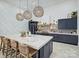 Spacious, modern kitchen featuring a marble countertop island, custom backsplash and pendant lighting at 1525 Shinnville Rd, Cleveland, NC 27013