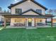 Charming covered porch features outdoor seating and a swing for relaxing at 1525 Shinnville Rd, Cleveland, NC 27013