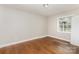 Bedroom featuring hardwood floors and natural light from a window at 1532 Downs Ave, Charlotte, NC 28205