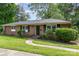 Charming brick home with a well-maintained lawn at 1532 Downs Ave, Charlotte, NC 28205