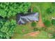 A stunning aerial view showcases the home nestled amongst lush greenery and a winding driveway at 1607 Old Lawyers Rd, Marshville, NC 28103