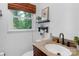 Bathroom with a vanity, granite countertop, and a window offering natural light and a view at 1607 Old Lawyers Rd, Marshville, NC 28103