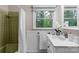 Bathroom featuring granite vanity, shower-tub combo and window at 1607 Old Lawyers Rd, Marshville, NC 28103