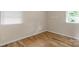 Cozy bedroom with hardwood floors and neutral walls and trim at 1607 Old Lawyers Rd, Marshville, NC 28103