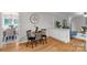 Cozy dining area with a round table, black chairs, and hardwood floors at 1607 Old Lawyers Rd, Marshville, NC 28103