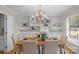 Charming dining room with a wooden table, upholstered chairs, and built-in shelving for storage and decor at 1607 Old Lawyers Rd, Marshville, NC 28103