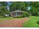 Single-story home surrounded by mature landscaping and green lawn at 1607 Old Lawyers Rd, Marshville, NC 28103