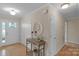 Warm foyer with hardwood floors, a console table, and a decorative mirror offering a welcoming entry at 1607 Old Lawyers Rd, Marshville, NC 28103