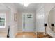 Inviting foyer featuring hardwood floors, neutral walls, and a front door with decorative glass inserts at 1607 Old Lawyers Rd, Marshville, NC 28103