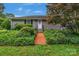 Ranch-style home with red walkway and mature landscaping at 1607 Old Lawyers Rd, Marshville, NC 28103