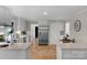 Bright kitchen with stainless steel appliances, white cabinetry, and hardwood floors at 1607 Old Lawyers Rd, Marshville, NC 28103