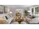 Comfortable living room with stylish sofas, a wooden coffee table, and a view into the adjacent dining area at 1607 Old Lawyers Rd, Marshville, NC 28103