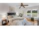 Serene main bedroom with wood floors, a ceiling fan, and a picturesque window view at 1607 Old Lawyers Rd, Marshville, NC 28103