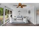 Cozy sunroom with seating, ceiling fan and string lights at 1607 Old Lawyers Rd, Marshville, NC 28103