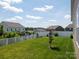 View of a newly installed lawn and privacy fence at 170 Atwater Landing Dr, Mooresville, NC 28117