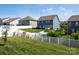 View of backyards with white fencing and newly installed lawn at 170 Atwater Landing Dr, Mooresville, NC 28117