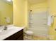 Bright bathroom featuring a shower and tub combination, single sink vanity, and a neutral color palette at 170 Atwater Landing Dr, Mooresville, NC 28117