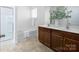 Bathroom features a double vanity, soaking tub, and a separate glass shower at 170 Atwater Landing Dr, Mooresville, NC 28117