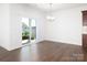 Bright dining area featuring hardwood floors and sliding glass doors to the backyard at 170 Atwater Landing Dr, Mooresville, NC 28117