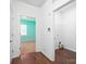 Hallway with open doorways to a bedroom and a walk in closet at 170 Atwater Landing Dr, Mooresville, NC 28117