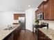 Spacious kitchen with stainless steel appliances, granite countertops, and a gas range at 170 Atwater Landing Dr, Mooresville, NC 28117
