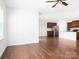 Open-concept living room and kitchen with stainless steel appliances and hardwood floors at 170 Atwater Landing Dr, Mooresville, NC 28117