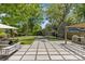 Backyard featuring a patio, outdoor kitchen, landscaping and artificial turf at 1726 The Plz, Charlotte, NC 28205