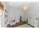 Bright bedroom with hardwood floors, modern lighting, and built-in shelving at 1726 The Plz, Charlotte, NC 28205