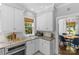 Bright kitchen features stainless appliances, granite counters, and ample storage at 1726 The Plz, Charlotte, NC 28205