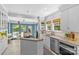 Bright, airy kitchen featuring granite countertops, white cabinetry, and stainless steel appliances at 1726 The Plz, Charlotte, NC 28205