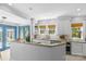 Spacious kitchen with granite counters, white cabinets, and sun-filled windows at 1726 The Plz, Charlotte, NC 28205