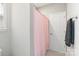 Clean bathroom with a pink shower curtain, a door, and a towel rack with a towel at 190 Tetcott St, Mooresville, NC 28115