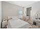 Cozy bedroom featuring neutral walls, a queen bed, and an ensuite bathroom, offering a peaceful retreat at 190 Tetcott St, Mooresville, NC 28115