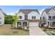 Inviting two-story home with a stone facade, a cozy porch, and a well-manicured front yard at 190 Tetcott St, Mooresville, NC 28115