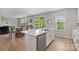 Open kitchen with a large island and seamless flow to the living and dining areas at 190 Tetcott St, Mooresville, NC 28115