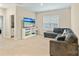 Spacious, carpeted living room with sectional sofa, entertainment center, and natural light at 190 Tetcott St, Mooresville, NC 28115