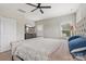 Spacious main bedroom with a large bed, dresser, and ceiling fan at 190 Tetcott St, Mooresville, NC 28115