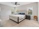 Comfortable main bedroom features a large bed, windows, and side tables at 190 Tetcott St, Mooresville, NC 28115