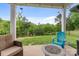 Covered patio with seating, a fire pit, and backyard views at 190 Tetcott St, Mooresville, NC 28115