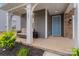 Welcoming front porch with seating, decorative accents, and a charming entrance at 190 Tetcott St, Mooresville, NC 28115