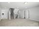 Spacious finished basement area with plush carpeting, bright lighting, and staircase access to upper floors at 2012 Embassy Ct # 46, Charlotte, NC 28213