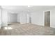 Large, open basement area featuring neutral carpet and multiple doorways, ready for customization at 2012 Embassy Ct # 46, Charlotte, NC 28213