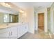 Modern bathroom featuring a double vanity, framed mirror, and a glass-enclosed shower at 2012 Embassy Ct # 46, Charlotte, NC 28213