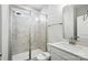 Bathroom with a glass-enclosed shower, white vanity, and marble-look tile at 2012 Embassy Ct # 46, Charlotte, NC 28213