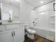 Well-lit bathroom featuring a shower and tub, vanity and wood look flooring at 2012 Embassy Ct # 46, Charlotte, NC 28213