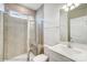 Clean bathroom with tiled shower, white sink, and modern fixtures at 2012 Embassy Ct # 46, Charlotte, NC 28213