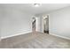 Bedroom featuring carpet flooring, neutral walls, and a hallway to a bathroom at 2012 Embassy Ct # 46, Charlotte, NC 28213