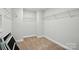 Walk-in closet featuring carpet flooring and white wire shelving at 2012 Embassy Ct # 46, Charlotte, NC 28213